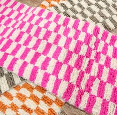 four crocheted rugs on the floor with different colors and patterns in them