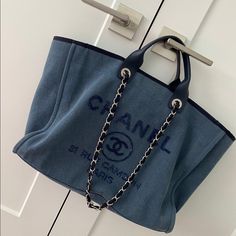 Authentic Chanel Tote Purchased From Boutique Blue Graphic Sequined Logo Silver-Tone Hardware Flat Handles & Chain-Link Shoulder Straps Canvas Lining & Three Interior Pockets Snap Closure At Top Excellent Condition, Clean Inside Out, Seal On Shoulder Strap Drop: 12" Handle Drop: 4" Height: 12" Width: 21" Depth: 6" Box, Authenticity Card, Dust Bags Are Included Chanel Gst, Chanel Canvas, Chanel Tote Bag, Chanel Tote, Quilted Tote Bags, Fabric Tote Bags, Black Leather Tote Bag, Denim Tote Bags, Fabric Tote