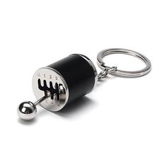 a black and silver keychain with the letter h on it's side