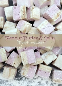 a pile of marshmallows sitting on top of a white counter next to a sign that says peanut butter and jelly