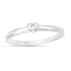 a white gold ring with a heart shaped diamond