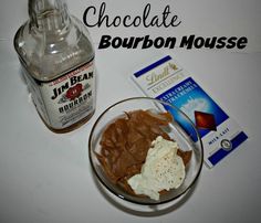 chocolate and bourbon mousse in a bowl next to a bottle of booze