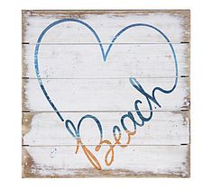 a wooden sign with the word love written in blue and orange on it's side