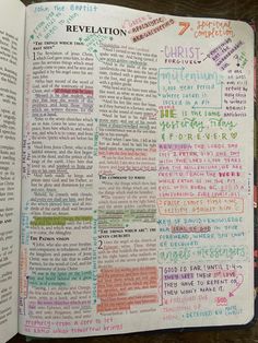 an open bible with colorful writing on it and the word salvation written in different languages