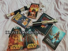 various star wars items on a bed with the words i love star wars