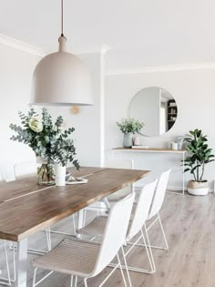 the instagram page on instagram shows an image of a dining room with white chairs and