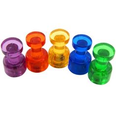 an assortment of colored glass knobs on a white background