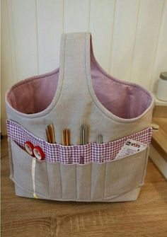 a sewing basket with scissors and thread in it