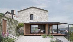 a stone house with wooden steps leading up to it