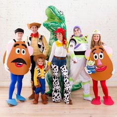 a group of people in costumes standing next to each other