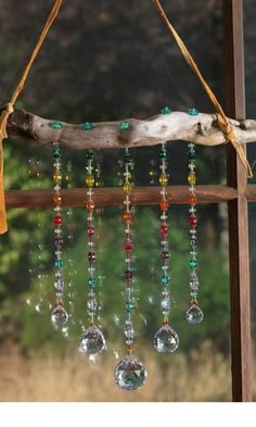 a wind chime hanging from a tree branch