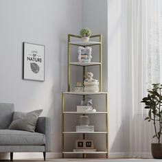 a living room filled with furniture and a tall shelf next to a couch in front of a window