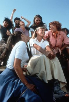 a group of women sitting next to each other