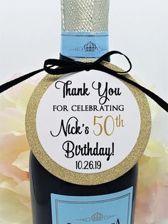 a bottle of wine with a label on it that says, thank you for celebrating nick's 50th birthday