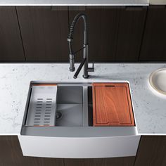 a kitchen sink with wooden cabinets and a faucet