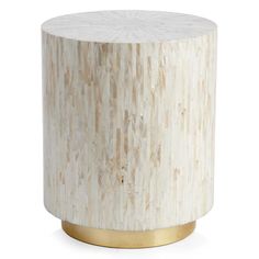 a white marble table with gold accents