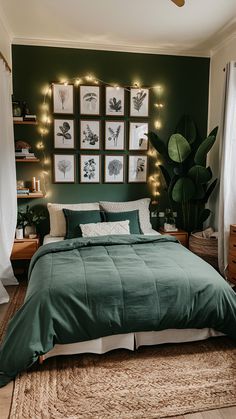 a bedroom with green walls and pictures on the wall above the bed in front of it