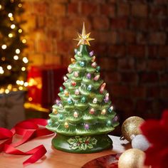 a small christmas tree sitting on top of a table