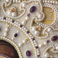 an elaborately designed purse with pearls and jewels