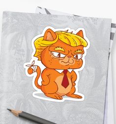 an orange cat sticker sitting on top of a piece of paper next to a pencil