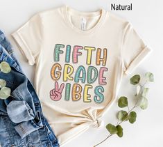 Retro Fifth Grade Vibes Shirt, 5th Grade Teacher TShirt, Teacher Team Shirts, Back to School Shirt, Kids First Day of Fifth Grade Tee More Grades and Styles Here: https://www.etsy.com/shop/TheGraphicPeach?ref=seller-platform-mcnav§ion_id=34195008 For environmental and human friendly reason, this product is only made when you order. Turnaround time is usually 1-5 business days before shipping, but can increase during holiday periods. Our professional printers always strive to ship as quickly as p Back To School Shirts, Graphic Tee T-shirt For Back To School Events, Fun Crew Neck T-shirt For Back To School, Retro Crew Neck T-shirt For Back To School, Back To School Text Print Crew Neck T-shirt, Fun Multicolor T-shirt For Back To School, Third Grade Teacher Shirts, Teacher Team, Third Grade Teacher