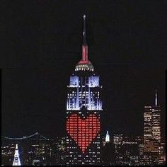 the empire building is lit up for valentine's day