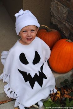 a little boy dressed up as a ghost