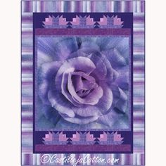 a purple flower is in the middle of a quilt