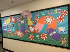 a bulletin board decorated with candy land and lollipops on the front wall