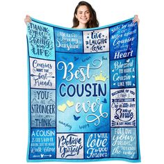 a woman holding up a blanket with the words best coustin ever on it