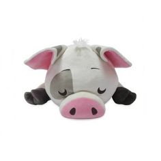 a small stuffed animal cow laying on top of a white floor