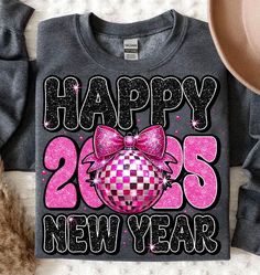 a happy new year shirt with a pink bow on it