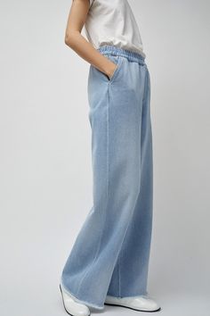 Wide leg jean cut in 100% cotton Japanese denim. High waisted with fully elasticated waistband and side slip pockets. Cool girl oversized slouchy fit and feel. DETAILS 100% Cotton. Made in Portugal. Machine Wash Cold. FIT Model is 5'11 U.S Size 0 wearing a size 34 pant. 34: Waist: 24", Hip: 39", Inseam: 30", Rise: 11.5". 36: Waist: 26", Hip: 41", Inseam: 31.5", Rise: 12". 38: Waist: 28", Hip: 43", Inseam: 32", Rise: 12.5" 40: Waist: 29", Hip: 45", Inseam: 32", Rise: 13". 42: Waist: 30", Hip: 47" Elastic Waist Jeans, Japanese Denim, Pants Outfit, Leg Jeans, Cool Girl, Fitness Models, Elastic Waist, Wide Leg, Light Blue