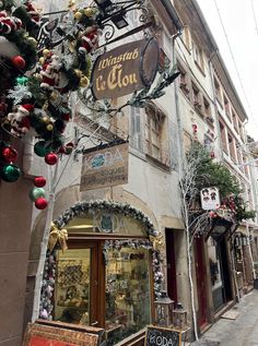 an old building with christmas decorations on the outside