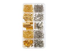 an assortment of gold and silver metal screws in a plastic container on a white background