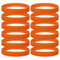 six orange rubber wristbands stacked on top of each other