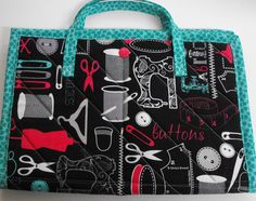 a black and blue bag with sewing related items on it