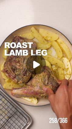 roast lamb leg and potatoes on a plate with the words roast lamb leg above it