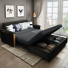 a living room with a couch that is open and has drawers underneath the sofa bed