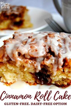 a piece of cake with icing on it sitting on a plate next to a fork