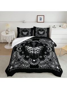 a black and white bed with skulls on it