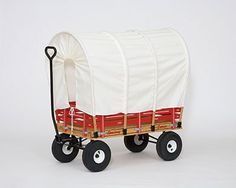 a red and white covered wagon with wheels