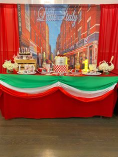 the table is set up with red and green cloths