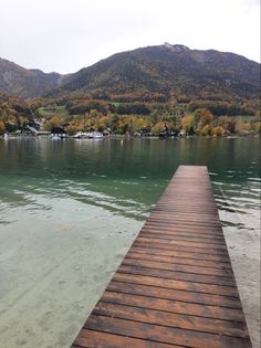 a wooden dock sitting on top of a body of water