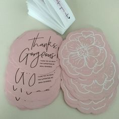 pink coasters with handwritten thank you're gorgeous written on them