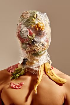 a woman with plastic bags on her back covered in food