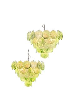 two yellow glass chandeliers hanging from hooks