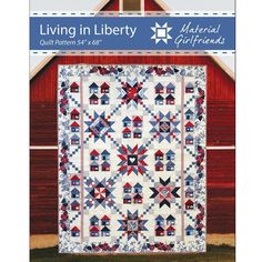 the cover of living in liberty quilt pattern book, featuring an image of a red barn and