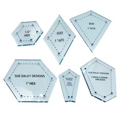 six clear glass hexagonals with white stitching on each side and the words sub daily designs next to them