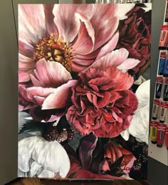 an oil painting of pink flowers on a canvas